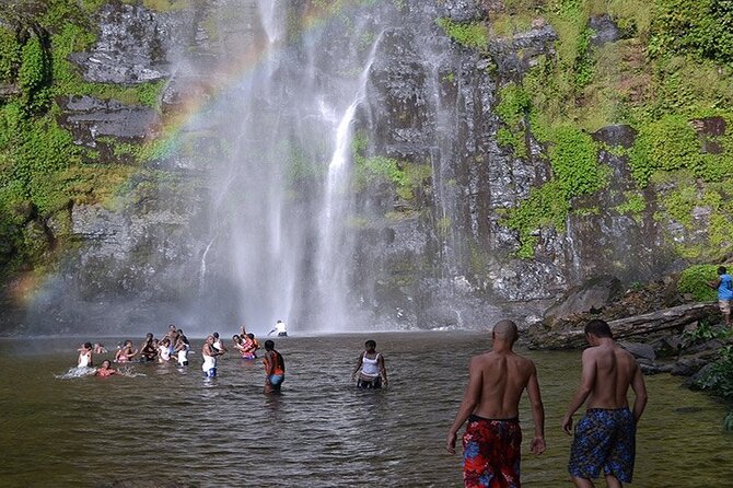 Swimmers under the lower fall at Wli, Volta Region